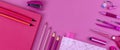 Pink school stationery on a pink background. Creative back to school concept.
