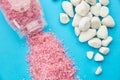 Pink sea salt on blue background, nobody Royalty Free Stock Photo