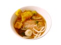 Pink seafood flat noodles with fish ball, dumpling fish on white