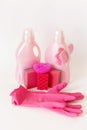 Pink set of products for washing and cleaning. Rubber gloves, gel bottles, sponges and rags. Royalty Free Stock Photo