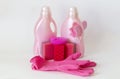 Pink set of products for washing and cleaning. Rubber gloves, gel bottles, sponges and rags. Royalty Free Stock Photo