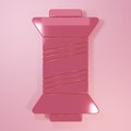 Pink Sewing thread on spool icon isolated on pink background. Yarn spool. Thread bobbin. Minimalism concept. 3D render Royalty Free Stock Photo