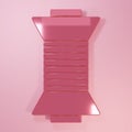 Pink Sewing thread on spool icon isolated on pink background. Yarn spool. Thread bobbin. Minimalism concept. 3D render Royalty Free Stock Photo