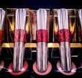 Pink shades of lip stain in shiny bottles on display