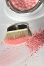 Pink shiny shimmer powder with wide makeup brush