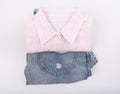 Pink shirt and blue jean on white background,top view Royalty Free Stock Photo