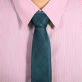 Pink shirt with dark blue necktie Royalty Free Stock Photo