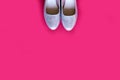 Pink shoes on a pink background.