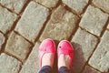 Pink shoes and jeans legs Royalty Free Stock Photo
