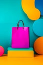 A pink shopping bag sitting on top of a stack of colorful boxes Royalty Free Stock Photo