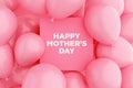 Pink sign frame with the message HAPPY MOTHER'S DAY surrounded with pink air balloons. Happy mothers day greeting celebration