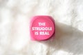 Pink sign with white lettering that says the struggle is real Royalty Free Stock Photo