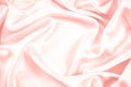 Pink silk satin background. Soft wavy folds on the fabric. Wedding, anniversary, Valentine`s day, celebration. Beautiful pink abst Royalty Free Stock Photo