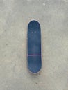 Pink Skateboard on Smooth Concrete Surface