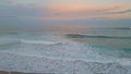 Pink sky ocean sunrise picturesque foamy waves aerial view. Surf rolling coast Royalty Free Stock Photo