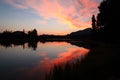 Pink sky over the lake in Rocky Mountain National Park during golden sunrise in Colorado Royalty Free Stock Photo