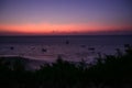 Pink sky over the ocean with sailboats Royalty Free Stock Photo