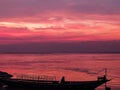 Pink sky in padma river with boat named T-badh Royalty Free Stock Photo