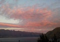 Pink sky while sunrise in Queenstown, alpine mountains and the lake Wakatipu