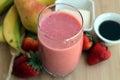 Pink smoothie made with strawberries, bananas, pears, tofu and maple syrup Royalty Free Stock Photo