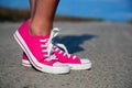 Pink sneakers on girl legs Royalty Free Stock Photo