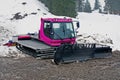 Pink snowcat in the dirt