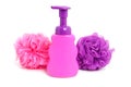 Pink soap bottle with purple sponge Royalty Free Stock Photo