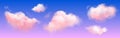 Pink soft fluffy clouds on violet-blue sky.