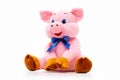 Pink soft toy pig bag for presents as a symbol of chinese new year isolated at white background Royalty Free Stock Photo