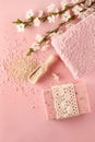 Pink spa set: bar of handmade soap, sea salt and towel. Blooming Royalty Free Stock Photo