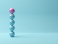 Pink sphere on stack of blue spheres on blue background, abstract modern minimal success, growth, progress or achievement concept Royalty Free Stock Photo