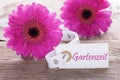 Pink Spring Gerbera, Label, Gartenzeit Means Garden Time Royalty Free Stock Photo
