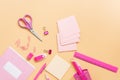 Pink stationery on a pastel yellow background, flat lay. Back to school. View from above, copy space