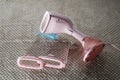 Pink Steamer iron close up. Household appliances photographed for sale Royalty Free Stock Photo