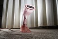 Pink Steamer iron close up. Household appliances photographed for sale Royalty Free Stock Photo