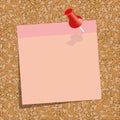 pink sticky note with a red push-pin against the background of cork board