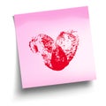 Pink sticky note with red thumbprint heart isolated on white.