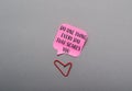 A pink sticky note with the words Do one thing every day that scares you Royalty Free Stock Photo