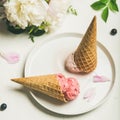 Ice cream scoops and peonies over white background, square crop Royalty Free Stock Photo