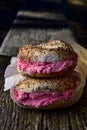 Pink strawberry cream cheese filled seeded bagel sandwiches
