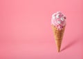 Pink strawberry ice cream scoop in waffle cone Royalty Free Stock Photo