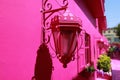Pink facade with a window and lantern in Puerto Plata, Dominican Republic Royalty Free Stock Photo