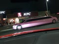 A pink stretch limousine