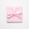 Pink striped pattern gift box isolated on white background Royalty Free Stock Photo