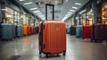 Pink suitcases in departure lounge, airport in background, summer vacation concept Royalty Free Stock Photo