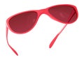 Pink sunglasses with tinted windows in the plastic frame