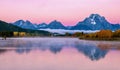A pink sunrise at the Oxbow Bend in the Snake River in Grand Teton National Park. Royalty Free Stock Photo