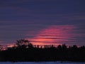 Pink sunset clouds during blue hour in Fingerlakes of NewYorkState in December supermoon Royalty Free Stock Photo