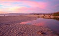 Pink sunset cloud reflection over Santa Clara river seaside marsh at Ventura beach in California USA Royalty Free Stock Photo