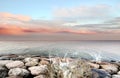 Pink sunset dramartic blue sky sea water splash rock stone nature landscape